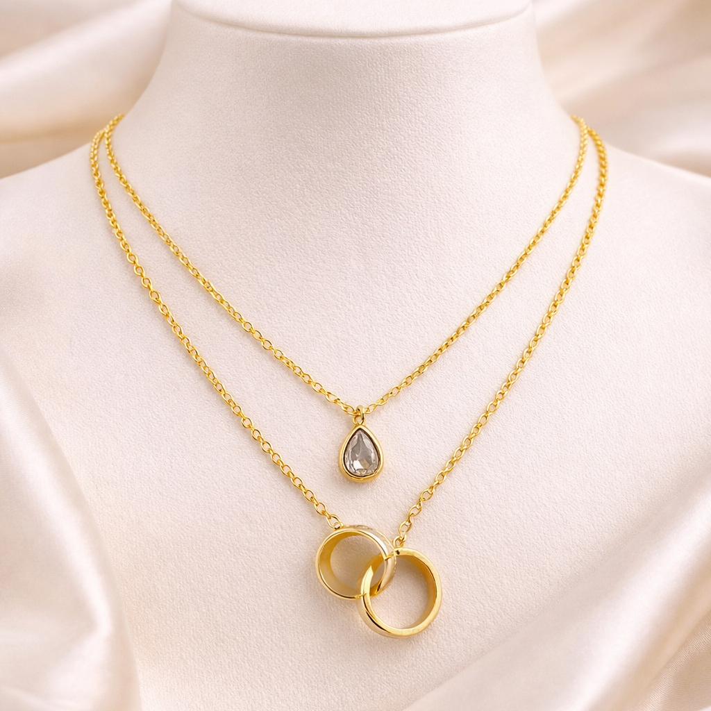 Dual Layered Necklace with Teardrop Stone & Interlocking Rings Pendant – Adjustable Chain | Imitation Gold